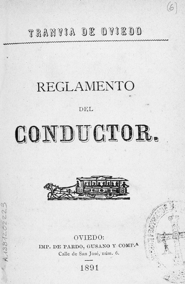 Altes Buch mit dem Titel "Reglamento de Conductor" und einer Zugzeichnung auf dem Cover und einem Stempel auf der rechten Seite.