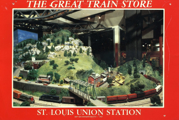 Ein Plakat mit einer Eisenbahn, die eine Brücke mit Truss-Struktur überquert, umgeben von Pflanzen, Häusern und Hügeln.