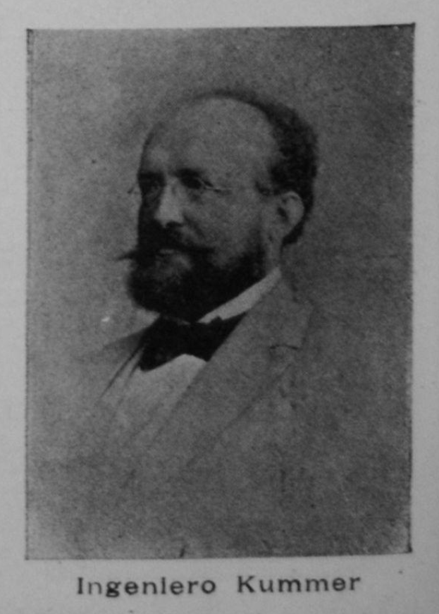 Ein Schwarz-Weiß-Foto eines bärtigen Mannes in einem Blazer und Brille mit der Beschriftung "Ingenlero Kummer, der Gründer der deutschen Revolution" unten.